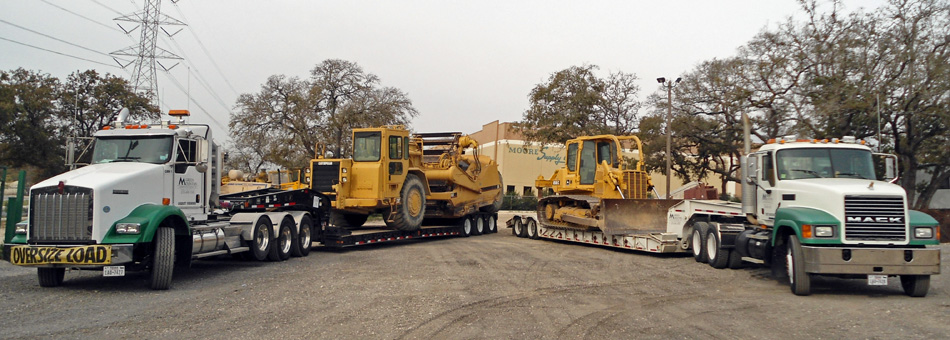 Equipment loaded on trucks